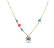 Ojo oro con piedra turquesa y coral