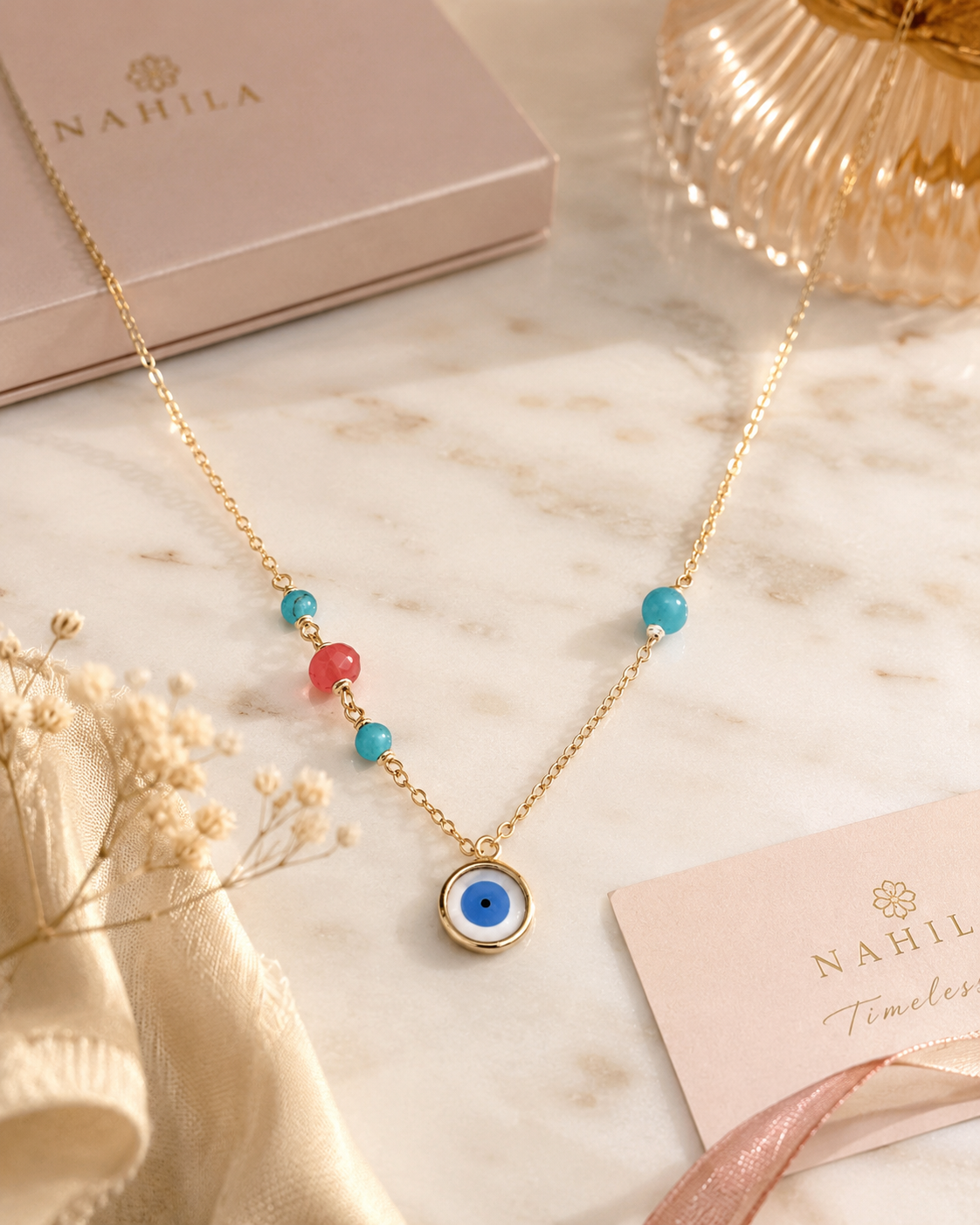 Ojo oro con piedra turquesa y coral