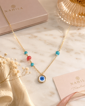 Ojo oro con piedra turquesa y coral
