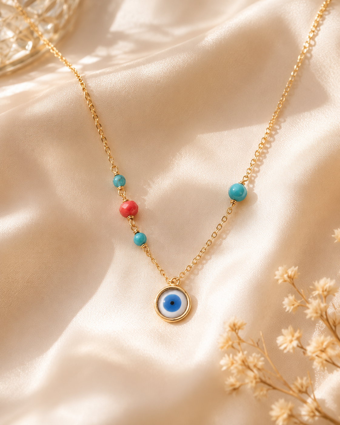 Ojo oro con piedra turquesa y coral